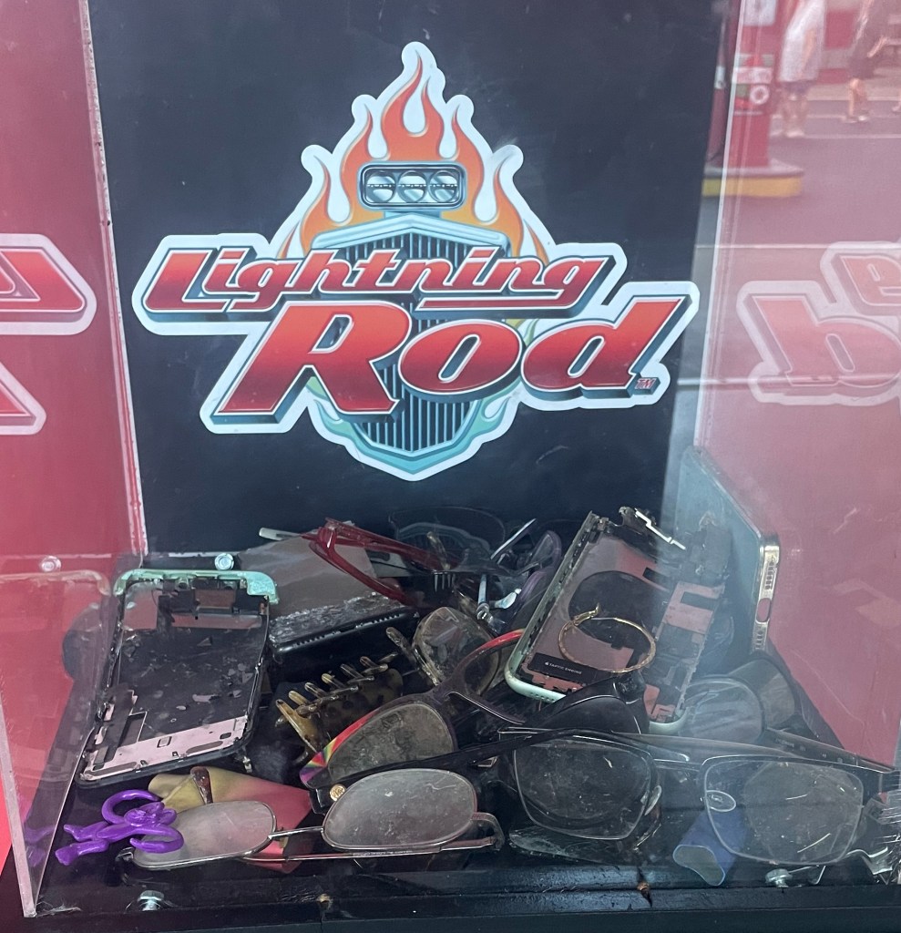 Lost items such as phones and glasses at entrance of Lightning Rod at Dollywood