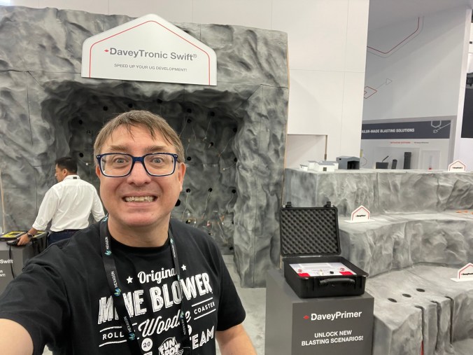 Man wearing Mine Blower t-shirt