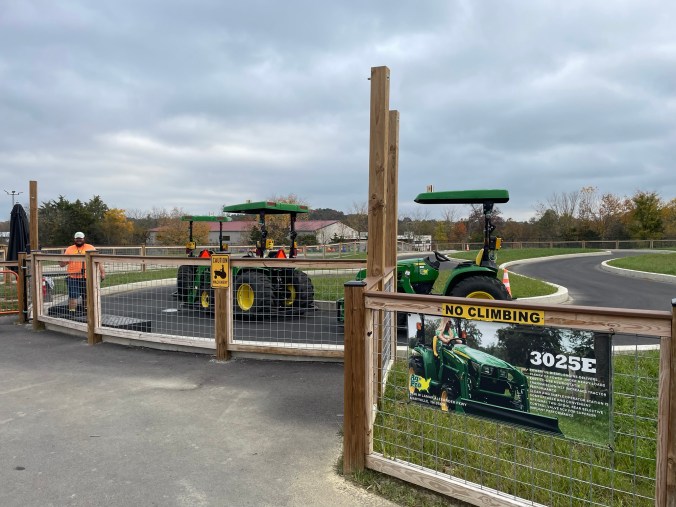 Farm Hands drive a tractor at Dig'n Zone