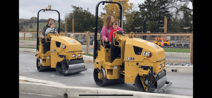 Kid riding on lap on giant roller