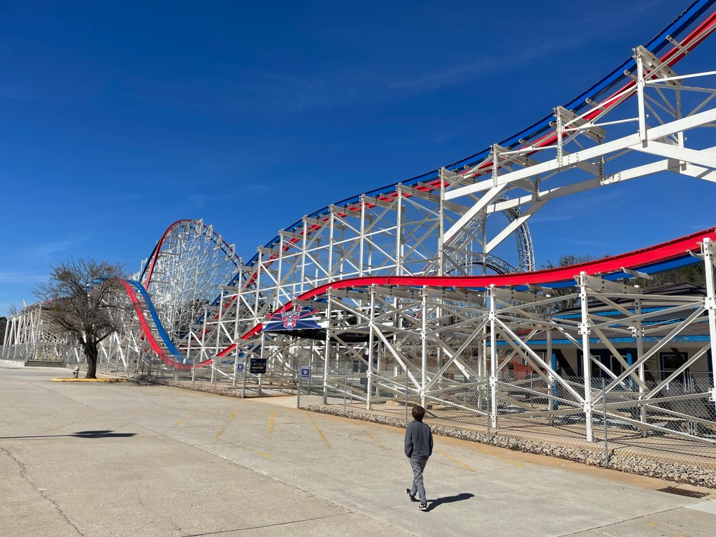 Cub scout in front of ArieForce One at Fun Spot Atlanta