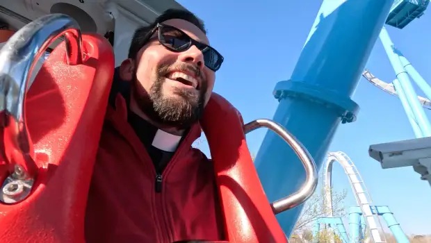 Fr. Anthony Ferguson rides a coaster
