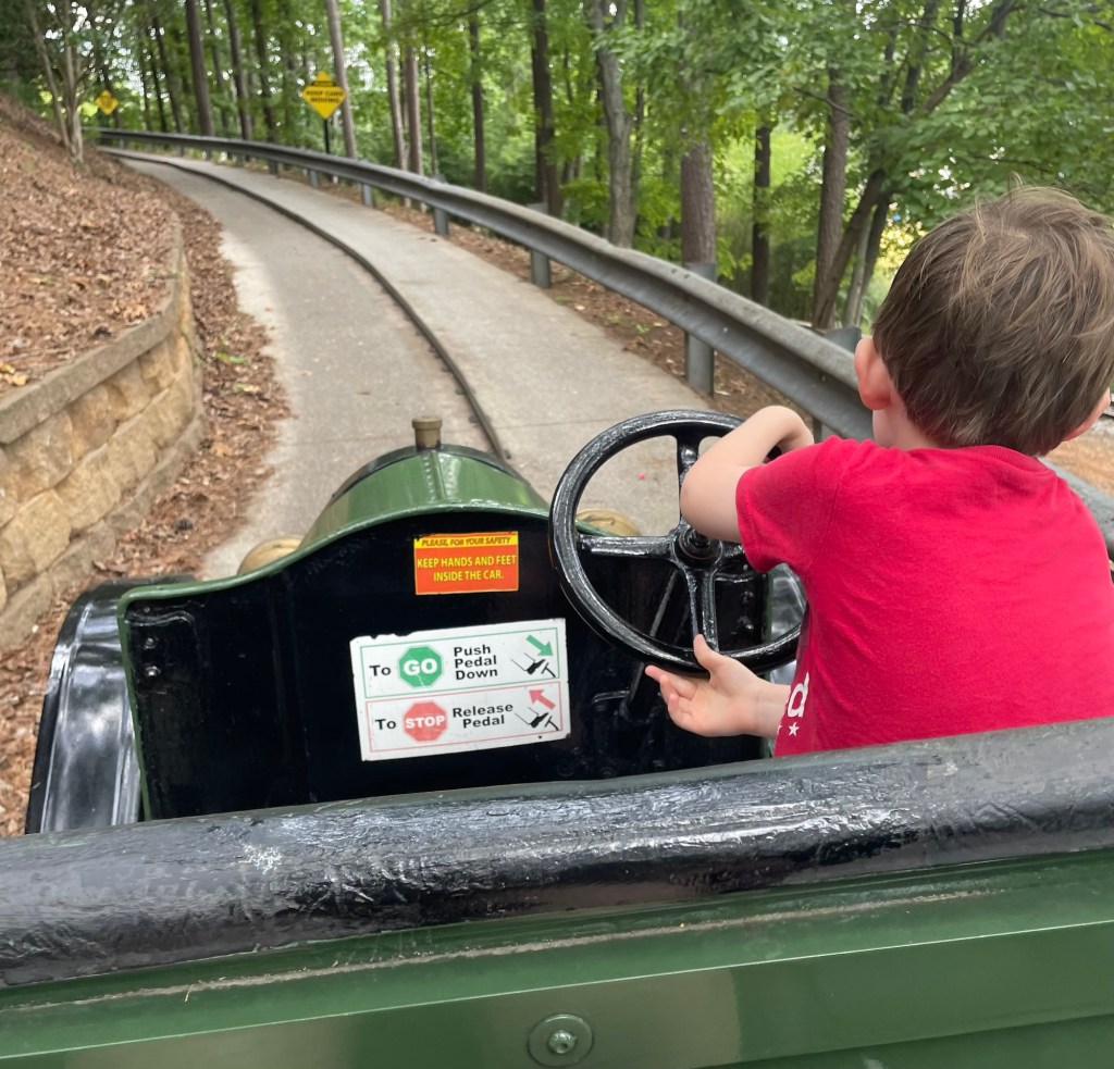 Boy driving Hanson Cars at Six Flags Over Georgia
