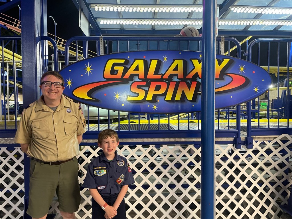 Scouts in front of Galaxy Spin sign at Fun Spot Kissimmee