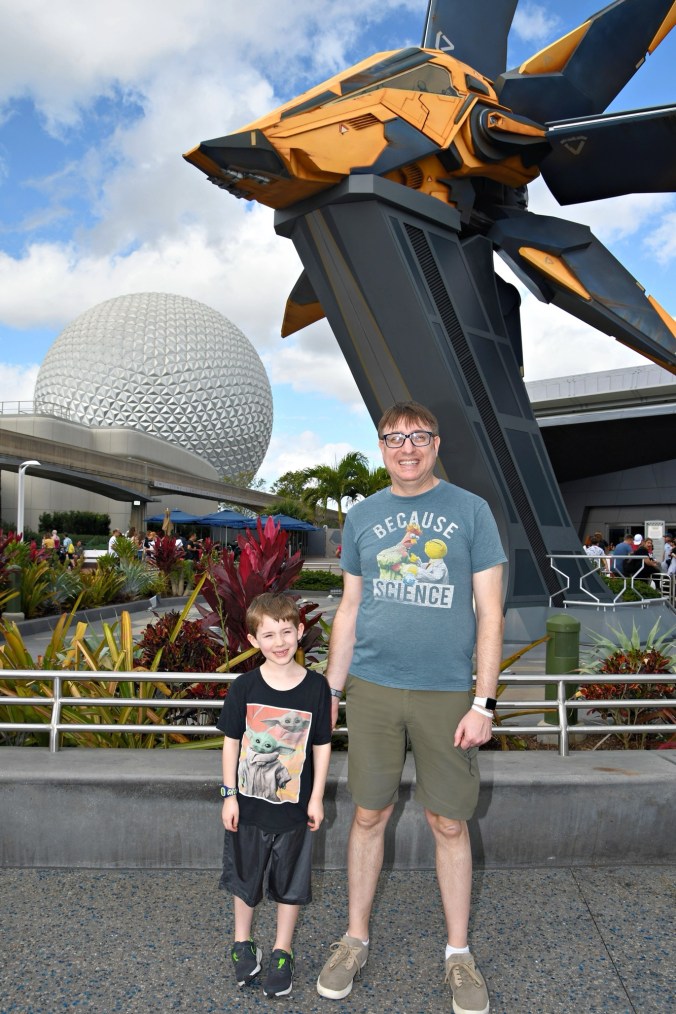 Boy and Father at EPCOT in front of Guardians of the Galaxy