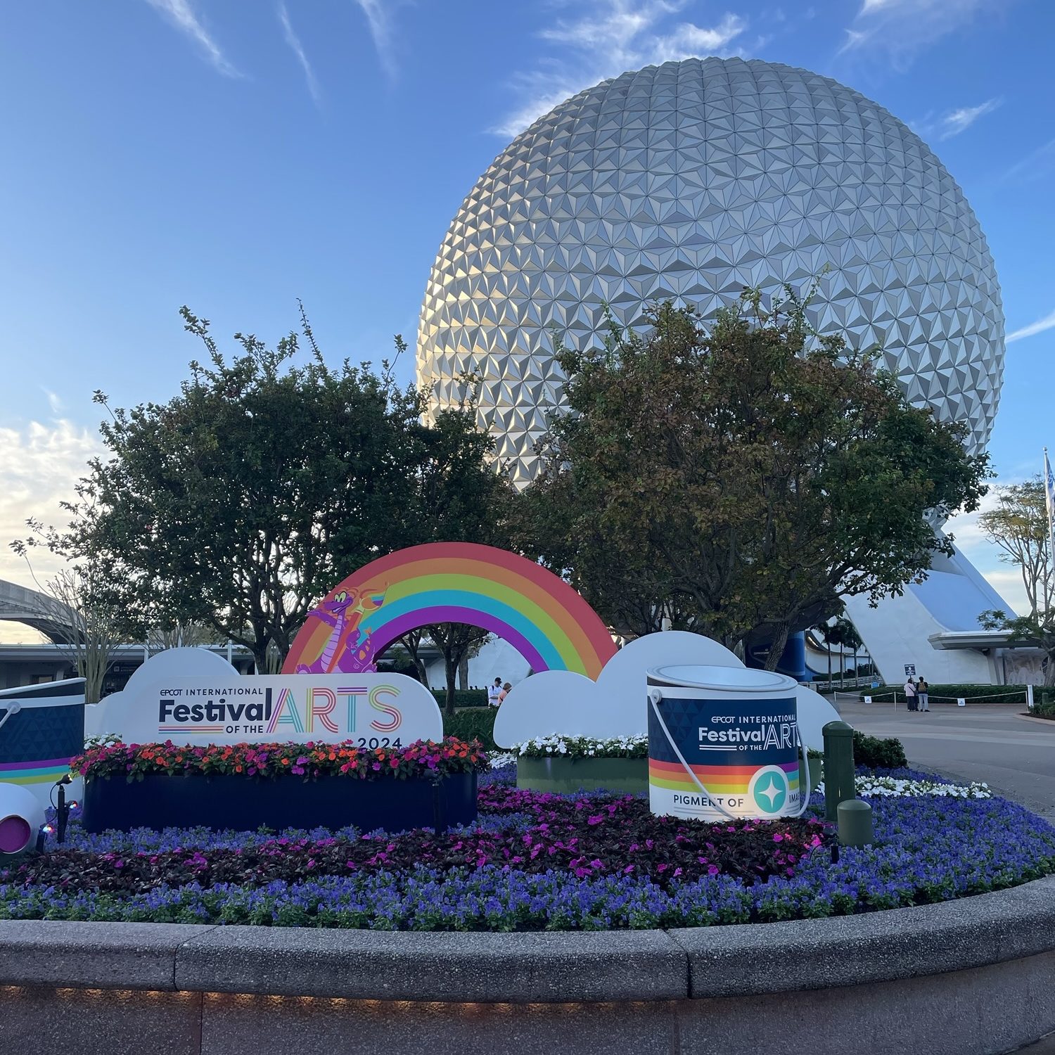 2024 EPCOT International Festival of the Arts sign in front of Spaceship Earth