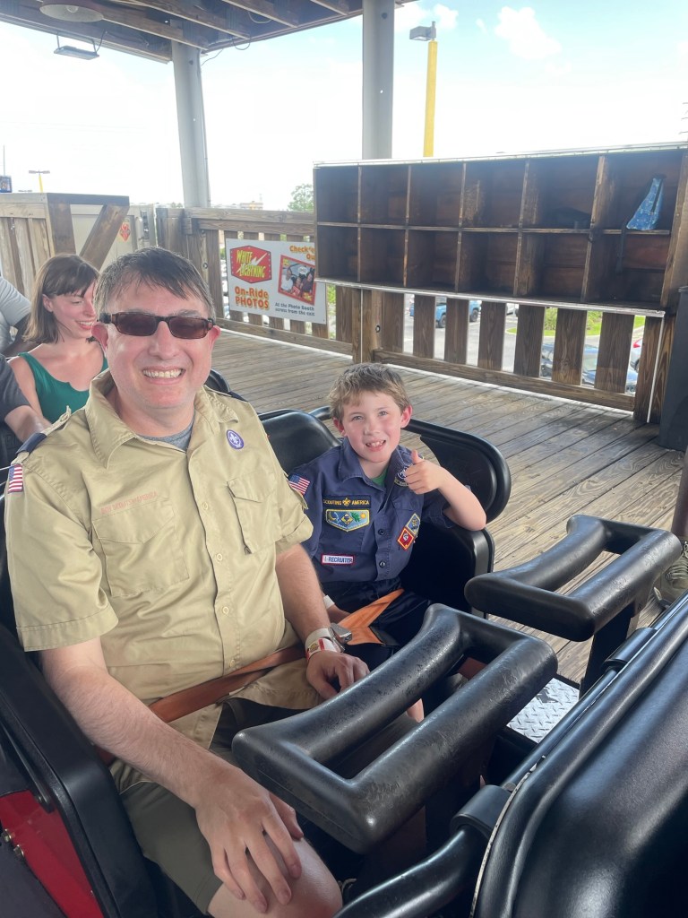 White Lightning car in station at Fun Spot Orlando with cub scout and scout leader