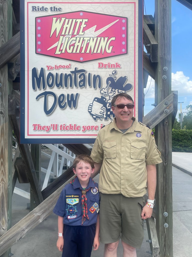 White Lightning sign at Fun Spot Orlando with cub scout and scout leader