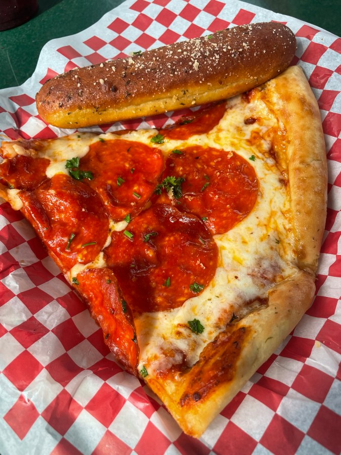 Pizza slice and Breadstick from Primo's pizza at Six Flags Over Georgia