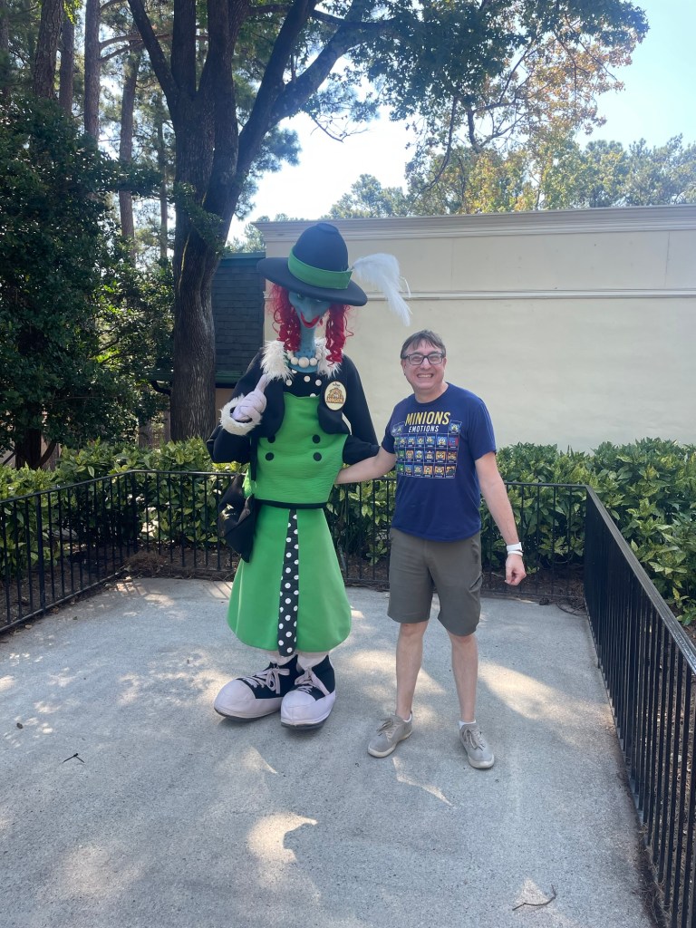Man with Haunted mansion monster at Six Flags Over Georgia
