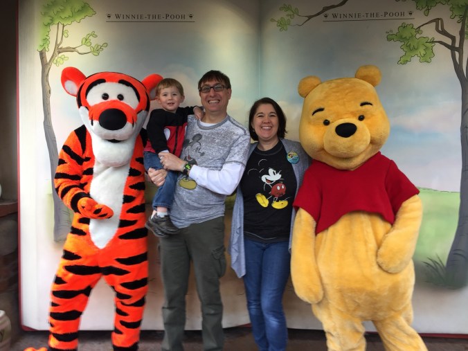 Pooh and Tigger with family at character meet and greet at Disney