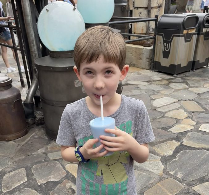 Kid drinking blue milk at Walt Disney World